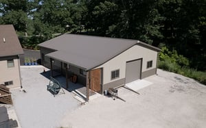 40x60 brown pole barn with porch