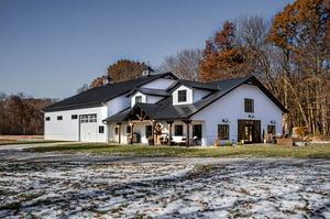 Black and white shome with cedar column porch